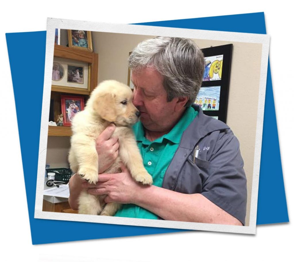 Man holding young puppy